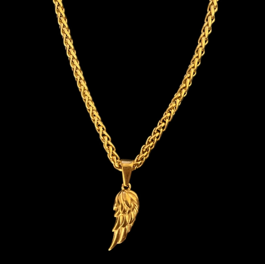 Gold wing pendant necklace on a braided chain, ideal for stylish layering and statement jewelry.