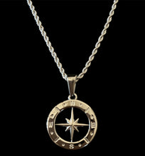 Silver compass pendant necklace on twisted chain, symbolizing direction and adventure in stylish jewelry.